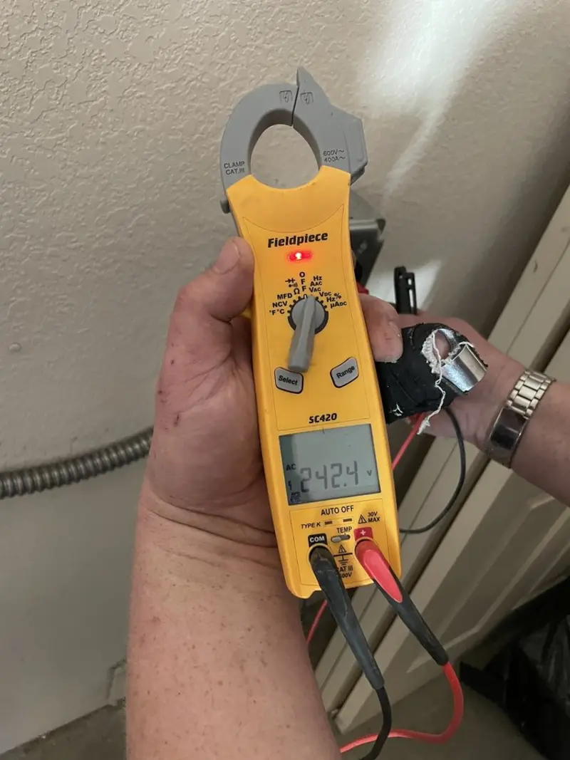 Voltage testing with clamp meter during Electrical Installation Services in Marietta